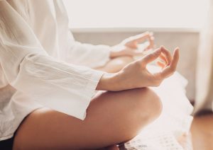 Woman mediating while at home